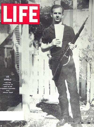 Lee Oswald with the weapons he used to kill President Kennedy and Officer Tippet.