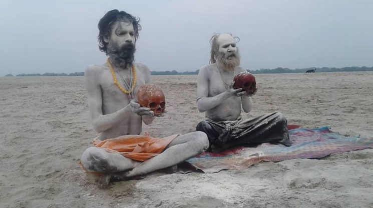 Aghori (which is translated as “fearless”) are holding human skulls, demonstrating acceptance of death.