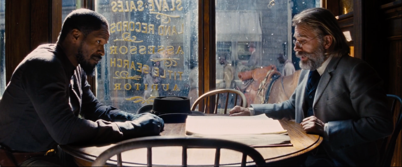 The scene of the partnership agreement between Django and Schultz in the cafe