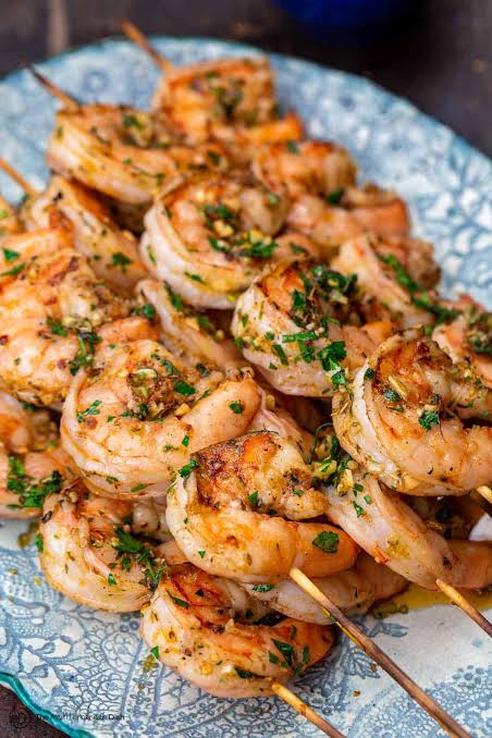 Grilled shrimp skewers with a garlic herb marinade