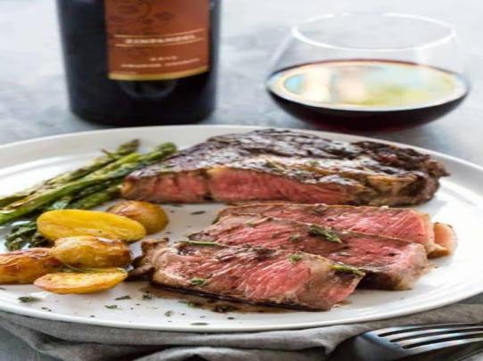 Grilled ribeye steak with a red wine reduction